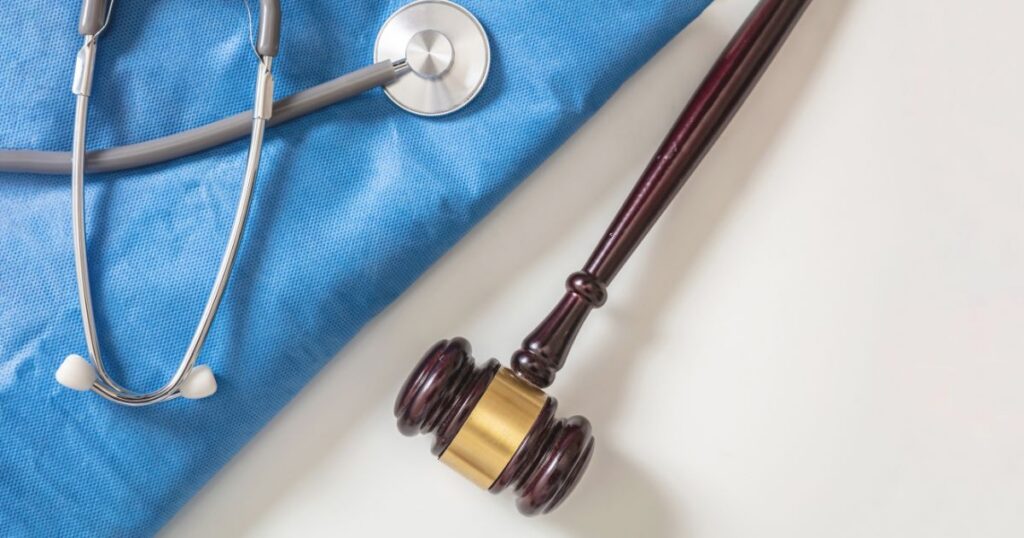 legal gavel next to a stethoscope